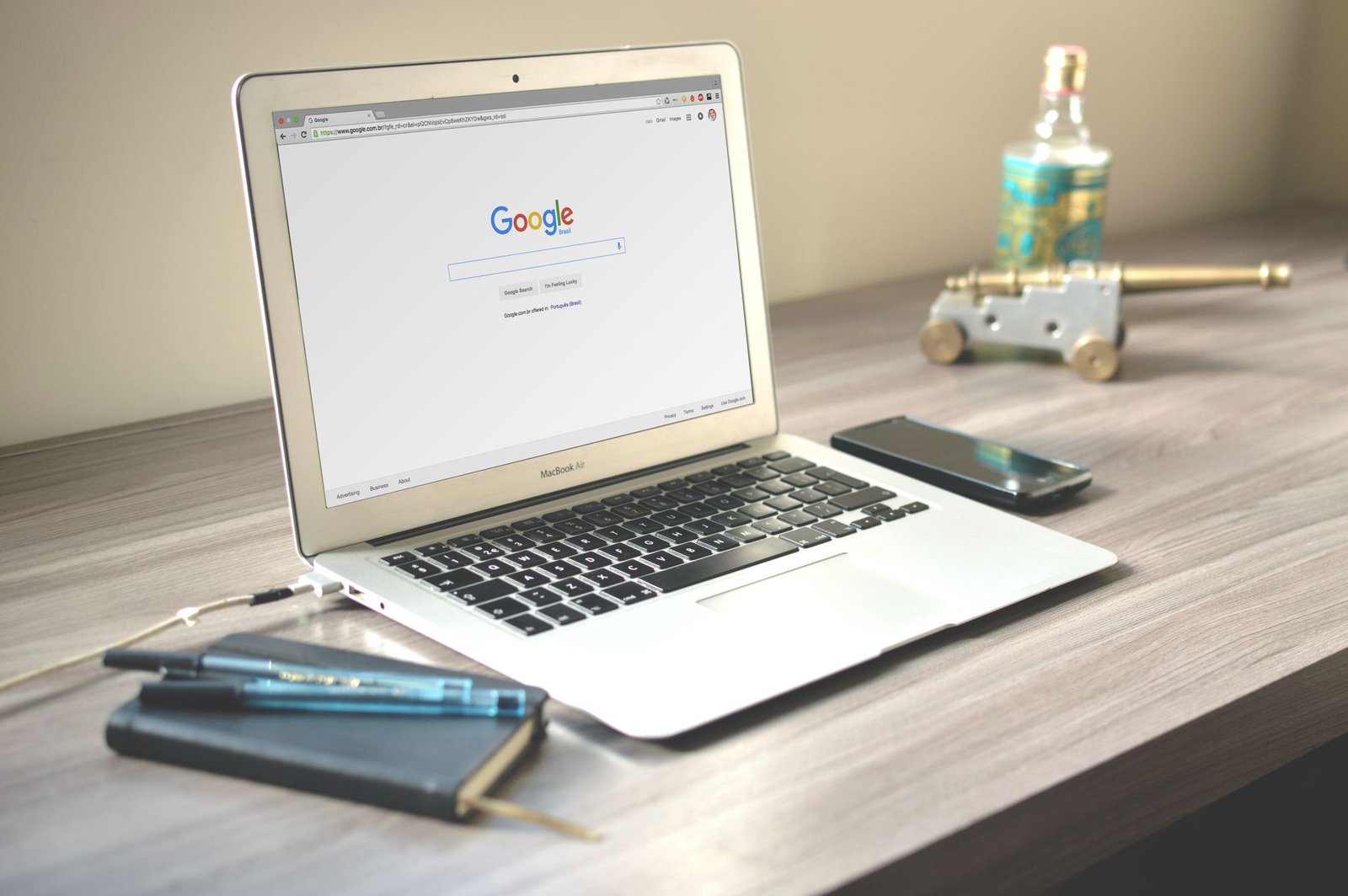A Neat Workspace Featuring A Laptop Displaying
