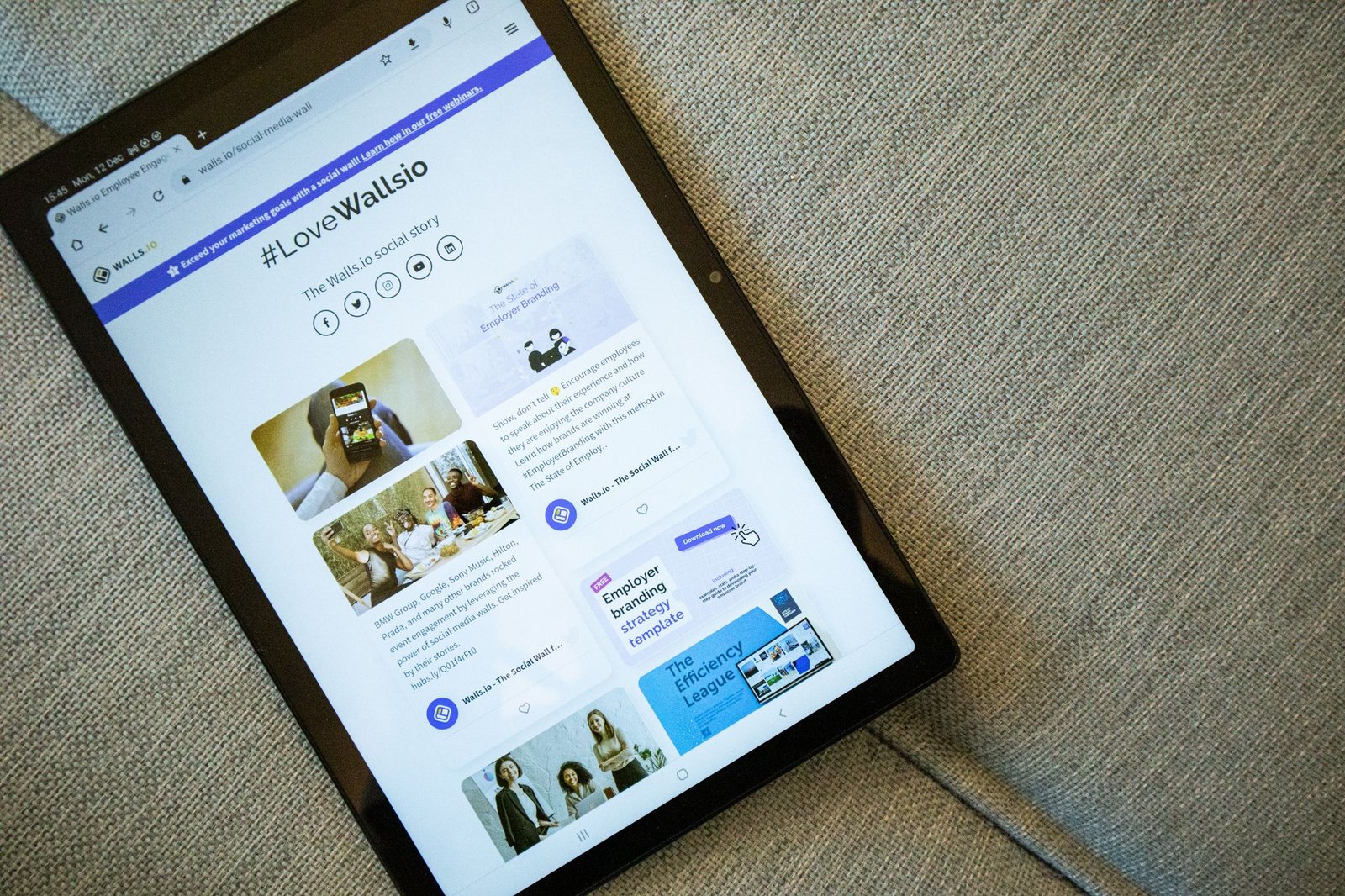 A Tablet On A Couch Showing The