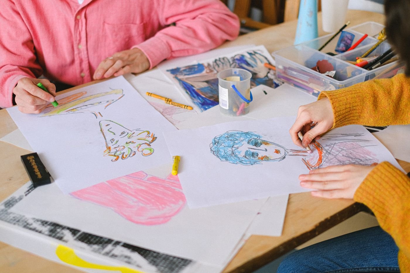 Designers working together around a studio table