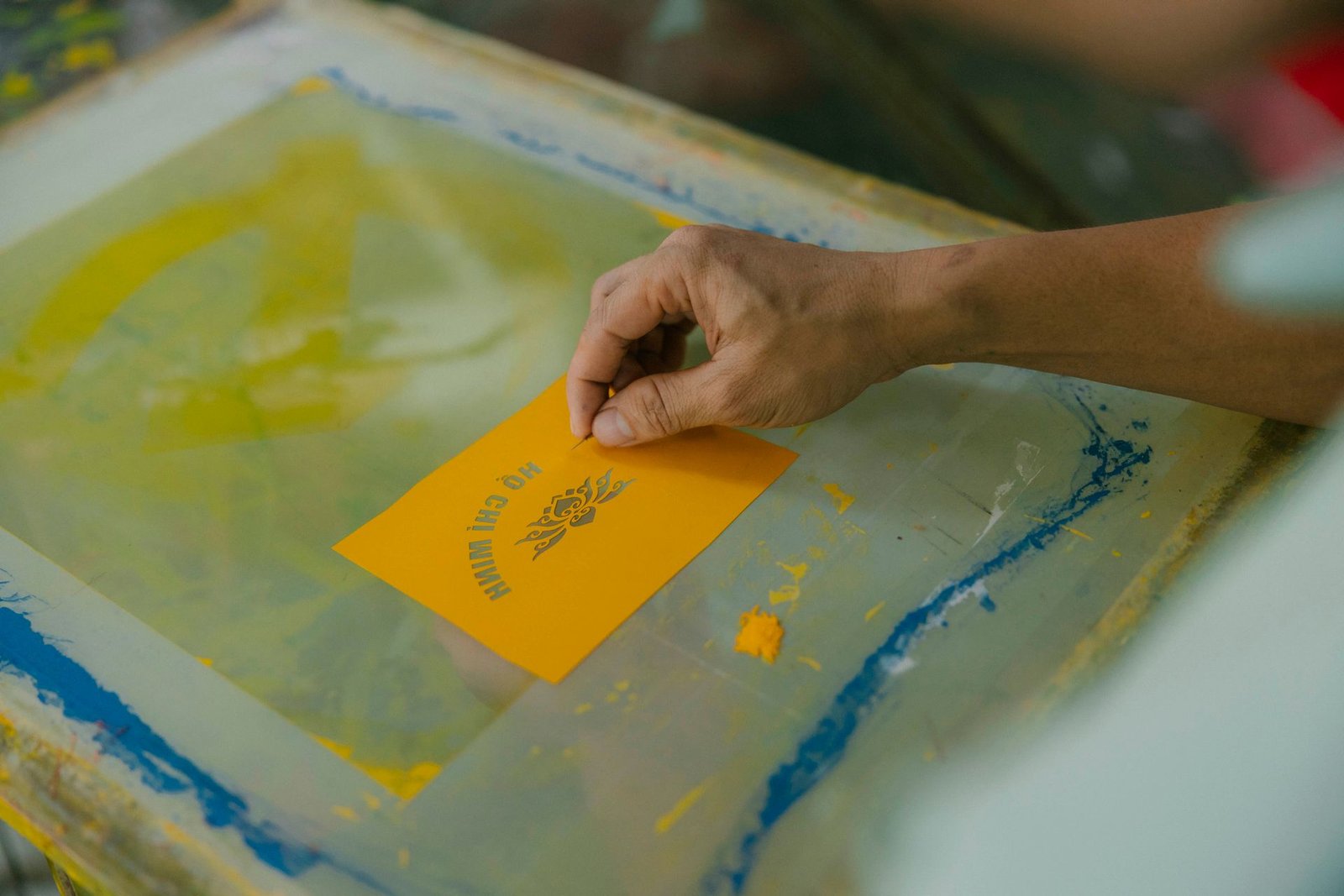 Graphic Design Screen printing colourful posters in a workshop