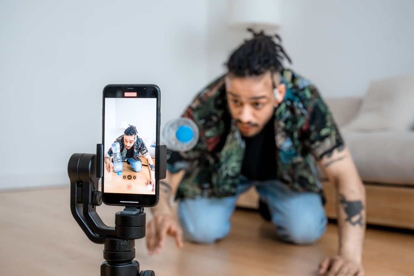 Home A content creator filming social media video on a bright set