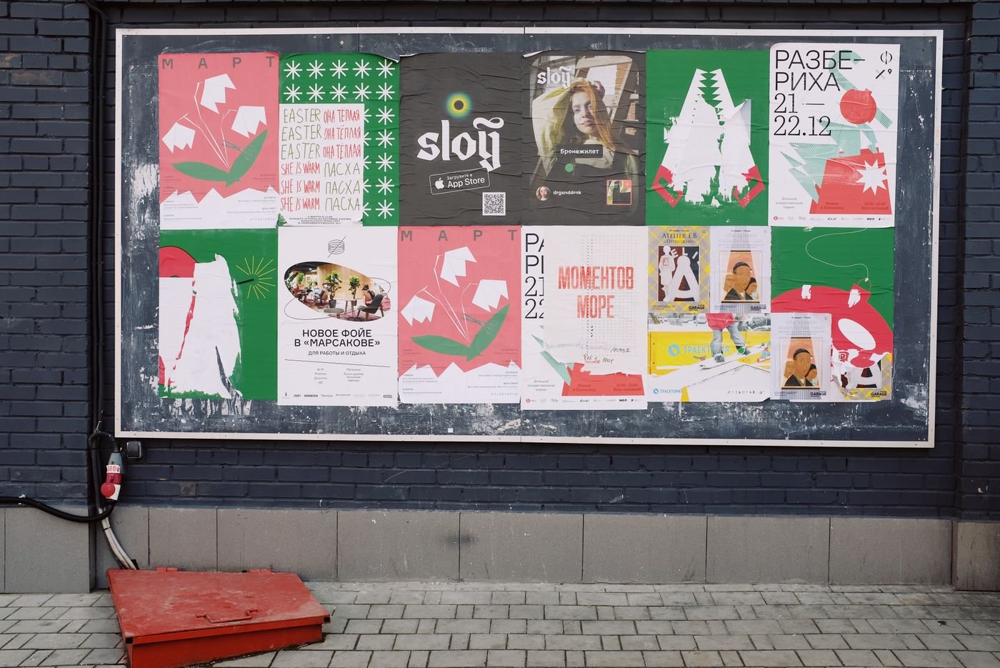 Home Colourful printed posters pinned across a studio wall