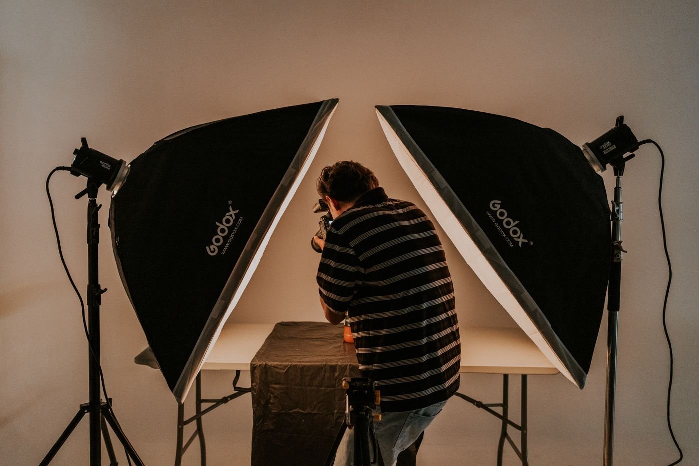 Home A photographer shooting under studio lighting