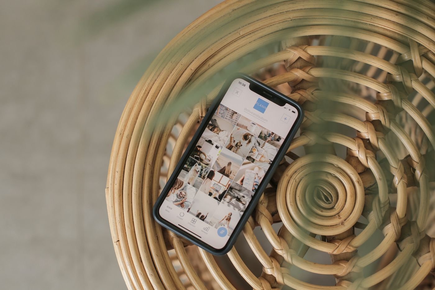 A colourful social media content grid on a phone