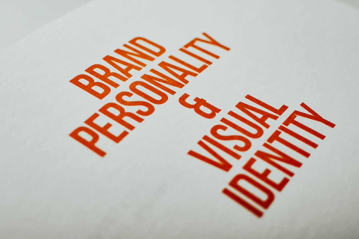 A brand guidelines spread showing typography rules