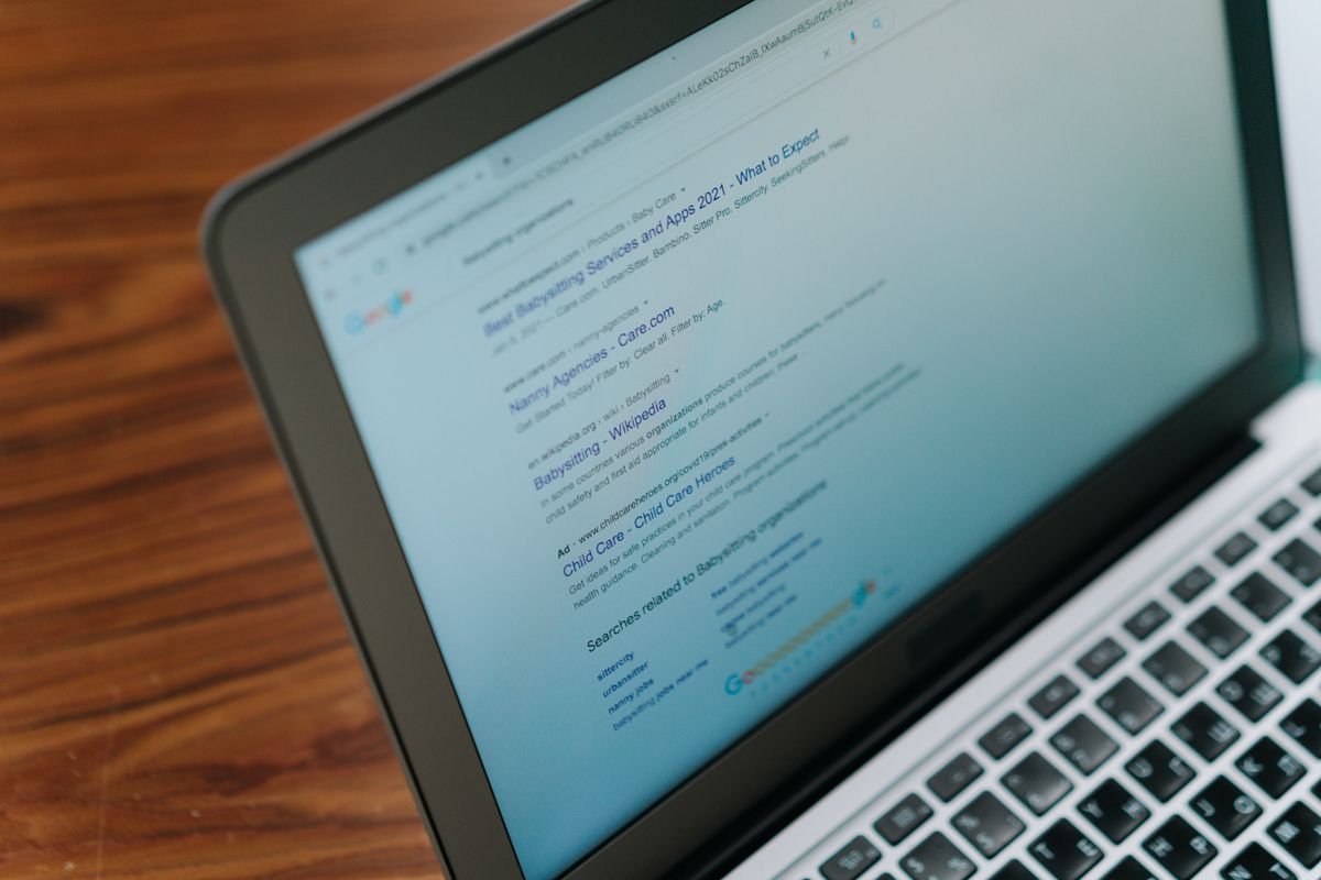 A search engine results page on a laptop